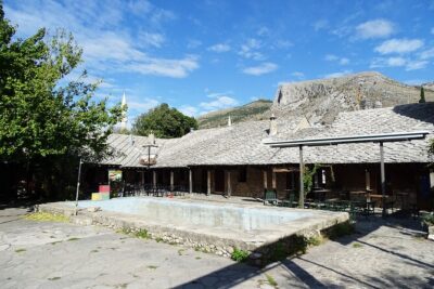 Walking Tour in Old Town Mostar - Crooked Bridge to the Old Bridge area: the first dramatic shift